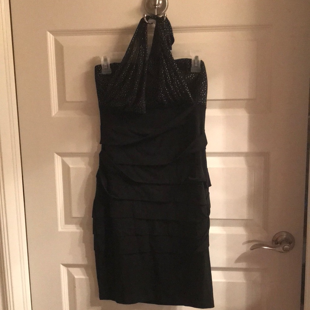 Sexy lil black dress with tieup around neck.  Pleated on bottom.